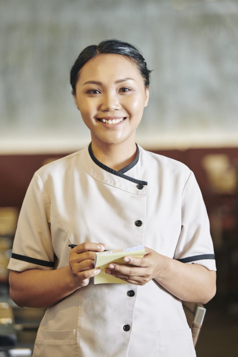 Waitress writing the order